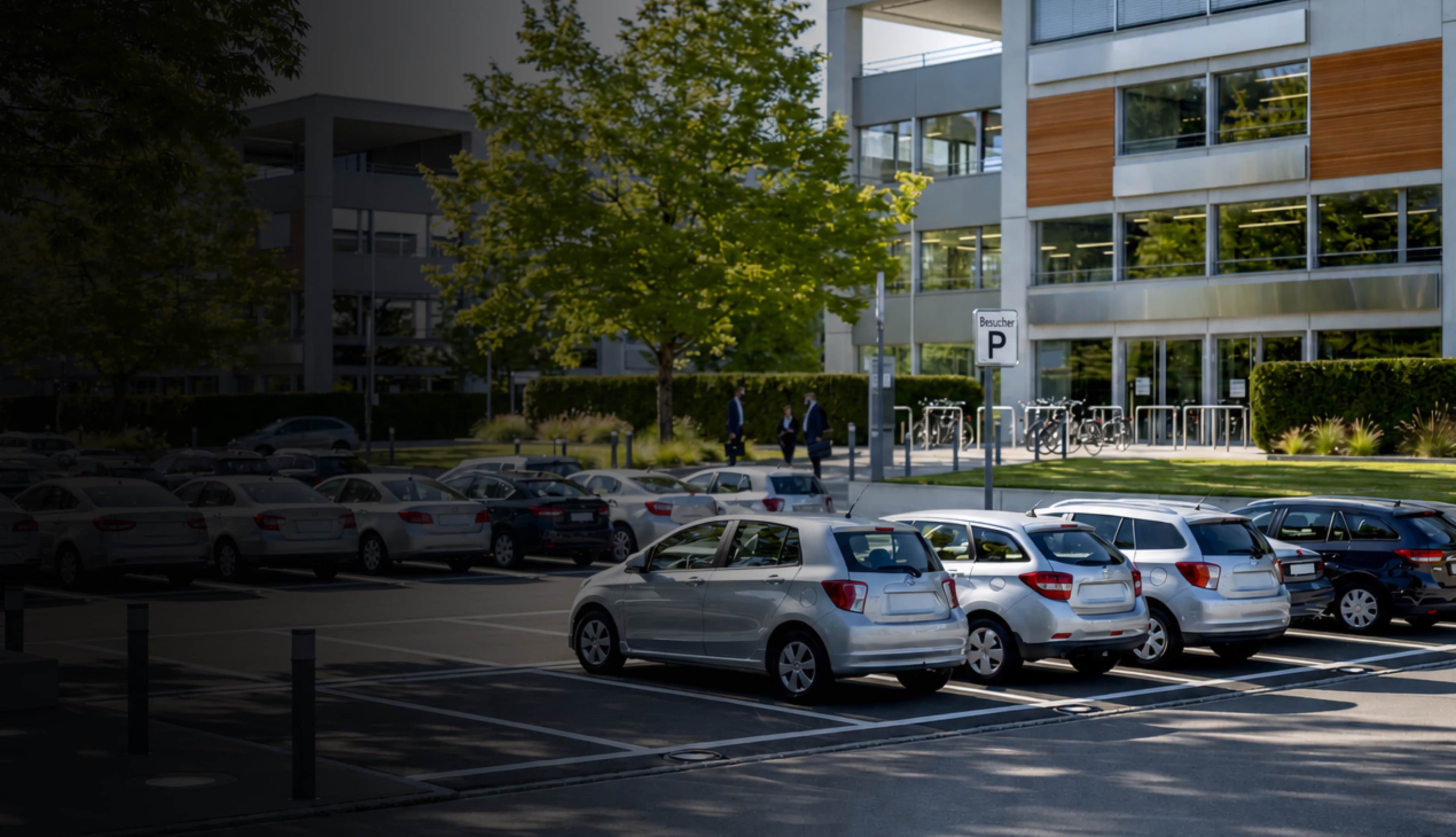 Car park entrance with vehicles driving in